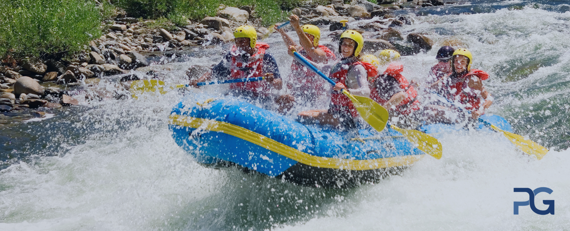 White-water rafting team navigating strong river rapids with teamwork and coordination.
