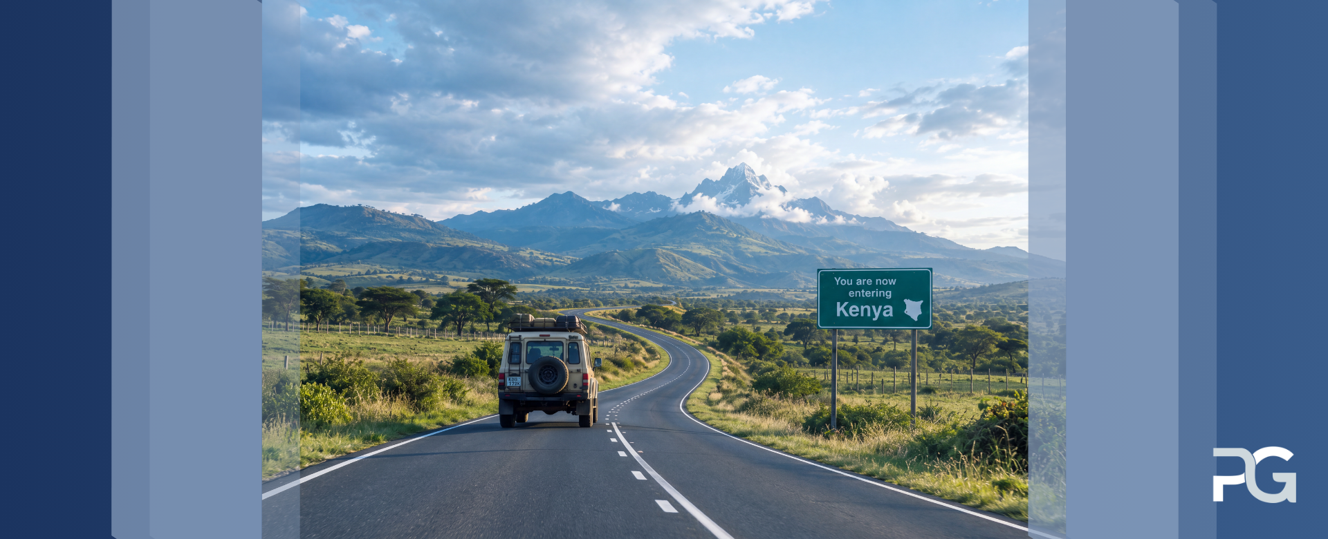 A rugged expedition vehicle drives along a long, empty road toward lush mountains under a dramatic sky.